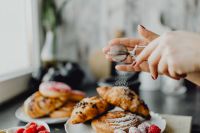 Kaboompics - Wide Bakery Scene with Croissants and Powdered Sugar
