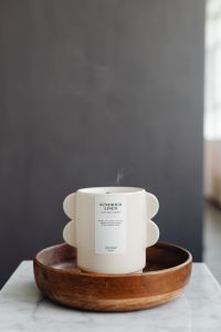 Kaboompics - Light Ceramic Candle on a Wooden Table