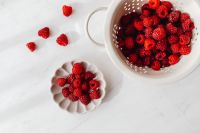 Kaboompics - Fresh Raspberries In A White Colander