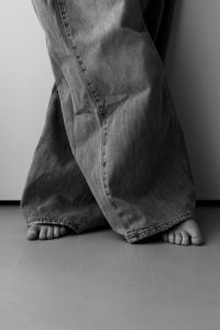 Kaboompics - Bare Feet and Flowing Black Trousers in Black and White