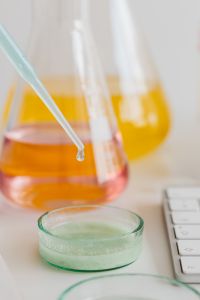 Kaboompics - Dropper and Colorful Chemistry Flasks on Laboratory Desk