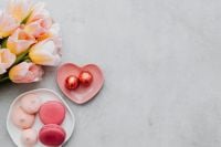 Kaboompics - Valentine Flatlay With Tulips, Heart Dish, Chocolates, and Macarons