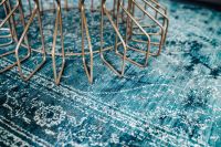 Kaboompics - Close-Up Blue Rug with Gold Chair Frame