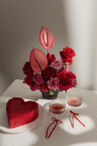 Kaboompics - Red Flower Arrangement with Heart Cake and Cocktail Glasses