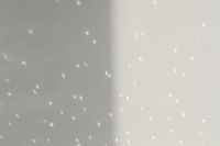 Kaboompics - Minimal White Wall Corner with Scattered Light Reflections