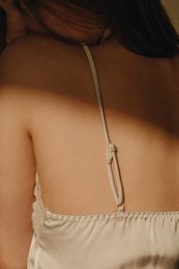 Kaboompics - Back View of Woman in Beige Satin Camisole with Lace Detail
