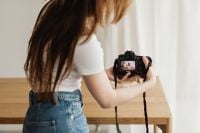 Kaboompics - Young Woman Photographer Creating Styled Tabletop Content