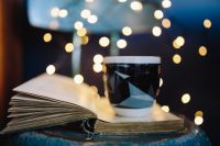 Kaboompics - Cup of coffee, book, fairy lights