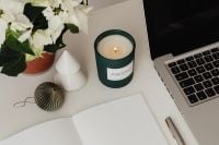 Kaboompics - Open Notebook and Laptop With Candle in Holiday Workspace