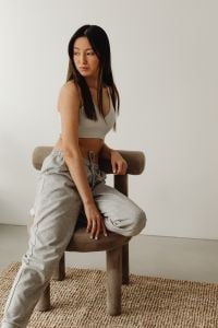 Kaboompics - Woman in a White Tank Top Turning to Look Over Her Shoulder