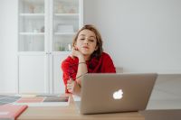 Kaboompics - Relaxed Woman Resting Chin on Hand at Laptop with Color Palette