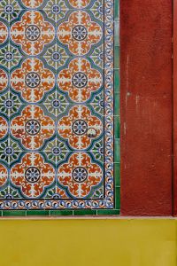 Kaboompics - Decorative Blue and Ochre Tiles Beside a Red Madrid Wall