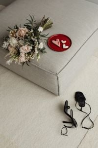 Kaboompics - Bouquet and Heart Cookies Styled on a Beige Chair with Heels