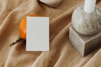Kaboompics - Orange and Business Card Mockup with Marble Decor on Soft Neutral Fabric