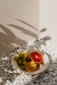 Kaboompics - Fruit Plate with Grapefruit, Orange and Grapes in Sunlight