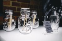 Kaboompics - Glass Reed Diffuser Bottles on Museum Display Shelf