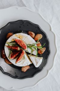 Kaboompics - Vertical Food Flat Lay of Camembert with Figs and Almonds