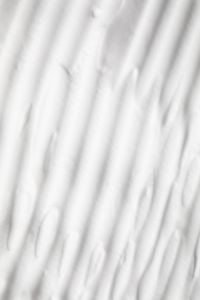 Kaboompics - Parallel Diagonal Cream Streaks in a Soft White Skincare Texture