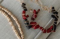 Kaboompics - Assorted Beaded Necklaces on a Neutral Sofa