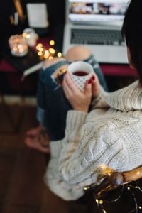 Kaboompics - Woman drinking hot tea in her home office