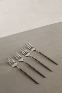 Kaboompics - Steel Forks with Geometric Shadows on a Two-Tone Minimal Background