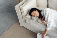 Kaboompics - Woman Sleeping on a Linen Sofa