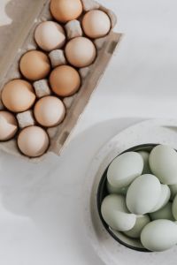 Kaboompics - Easter flat lay with green eggs on a white marble