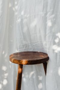 Kaboompics - Wooden Stool Against a Sheer Curtain Background