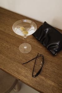 Kaboompics - Martini Cocktail with Black Clutch and Sunglasses