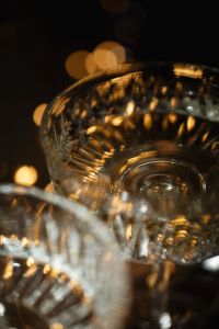 Kaboompics - Golden Champagne Coupe Glass with Warm Bokeh