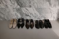Kaboompics - Row of Neutral and Black Shoes on White Shelf
