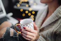 Kaboompics - Woman drinking hot tea in her home office