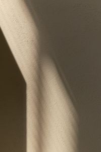 Kaboompics - Warm Beige Abstract Background with Curved Sunlight and Shadows