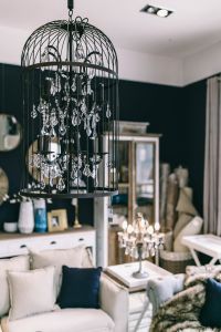 Eclectic Vintage Living Room With Crystal Chandeliers And Blue Accents