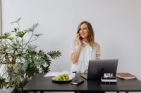 Kaboompics - Freelancer Holding Glasses During an Office Phone Call