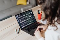 Kaboompics - Woman Typing on Laptop at Desk