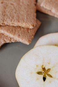 Kaboompics - Whole-Grain Crispbread and Fresh Apple Slice, Close-Up of a Simple Healthy Snack