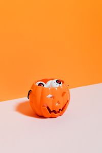 Kaboompics - Halloween Pumpkin Bucket Filled with Eyeball Props