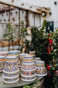 Kaboompics - Patterned Ceramic Flower Pots and Greenery in a Shop Courtyard