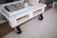 Kaboompics - Small wooden table with a potted plant and a grey wallet