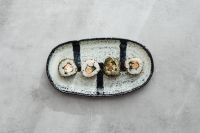 Kaboompics - Overhead Maki Sushi on Oval Platter with Copy Space