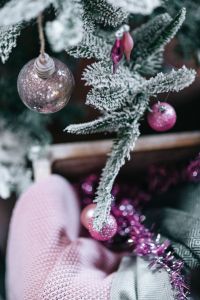 Kaboompics - Frosted Tree Branch With Pink Ornaments And Tinsel