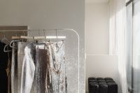 Kaboompics - Glittering Party Outfits on Clothing Rack in Bright Interior