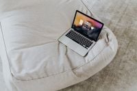 Kaboompics - Laptop Workspace on Cozy Beige Sofa with Copy Space