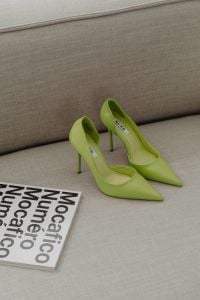 Kaboompics - Lime Green Pointed Heels on a Sofa with Fashion Magazine