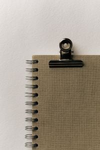 Kaboompics - Minimalist Spiral Notebook with Black Binder Clip