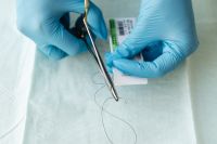 Kaboompics - Gloved Hands Handling a Surgical Needle Holder