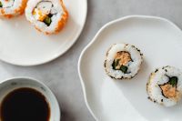Kaboompics - Sesame Sushi Rolls and Soy Sauce in Neutral Tabletop Food Styling