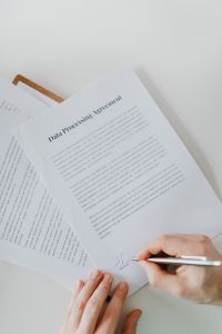 Kaboompics - Doctor Reviewing Printed Patient Documentation