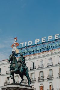 Kaboompics - Madrid Equestrian Statue and Rooftop Sign Above an Ornate White Facade